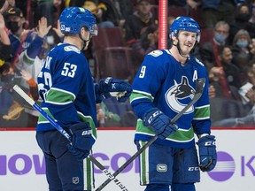 While J.T. Miller (right) may well welcome a return to Rogers Arena after playing away from home for more than a month, captain Bo Horvat (left) won’t be so fortunate as he enters the NHL’s COVID-19 protocol and will miss the club’s three-game homestand, at the very least.