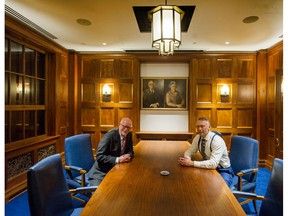 Donald Luxton, left, and Drew Ratcliffe in the restored art deco boardroom from the Georgia Medical Dental Building, which was torn down in 1989. The boardroom was salvaged and has been installed in a new building at 1575 West Georgia St. Ratcliffe's grandfather, Arne Matheson, saved the boardroom, and portraits of Matheson and his wife were put up in the room