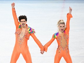 Canada's Piper Gilles and Canada's Paul Poirier compete in the ice dance rhythm dance of the figure skating event during the Beijing 2022 Winter Olympic Games at the Capital Indoor Stadium in Beijing on February 12, 2022.