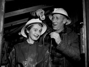 Vancouver Sun reporter Mary McAlpine gets outfitted with a construction helmet in the tunnel beneath Ripple Rock on Dec. 13, 1957. Ripple Rock was an underwater mountain in Seymour Narrows near Campbell River that was a notorious marine hazard until the top of the underwater mountain was blown up April 5, 1958.