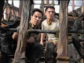 Victor "Sully" Sullivan (Mark Wahlberg) and Nathan Drake (Tom Holland) look to make their move in Columbia Pictures' Uncharted.