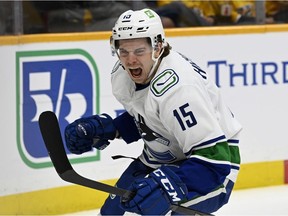 Vancouver Canucks centre Matthew Highmore (15) celebrates after scoring a goal against the Nashville Predators during the first period of an NHL hockey game Tuesday, Feb. 1, 2022, in Nashville, Tenn.