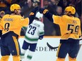 Nashville Predators left wing Filip Forsberg (9) celebrates with defenceman Roman Josi (59) after a goal during the second period against the Vancouver Canucks at Bridgestone Arena.