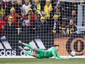 Vancouver Whitecaps keeper Thomas Hasal is unable to stop a goal by Columbus Crew forward Miguel Berry at Lower.com Field in last season's season-opening 4-0 loss to Columbus.