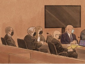 Three former Minneapolis officers, Tou Thao, J. Alexander Kueng and Thomas Lane, sit with their lawyers during their trial as they are charged with violating George Floyd's civil rights during his 2020 arrest, in St. Paul, Minnesota, U.S., January 24, 2022 in this courtroom sketch.