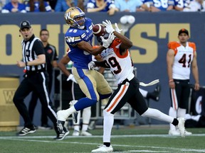 Blue Bombers receiver Kenny Lawler (left), juggling a pass against the Lions secondary during a 2019 CFL game in Winnipeg, has been tendered a free agent offer by the Leos.