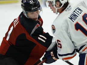 Vancouver Giants forward Fabian Lysell is checked by Kamloops Blazers centre Fraser Minten last year at the Langley Events Centre.