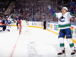 Vasily Podkolzin  of the Vancouver Canucks celebrates his third period goal against the New York Islanders at the UBS Arena on March 03, 2022 in Elmont, New York.