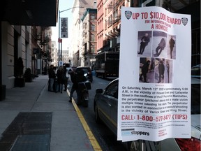 Police posters are placed along a street where a homeless man was recently killed on March 14, 2022 in New York City.