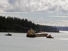 Update: Port of Vancouver says it was a grain ship leaving Vancouver that had mechanical difficulty, not a moored ship breaking loose. VANCOUVER (Marh 3, 2022) -- A bulk cargo freighter that broke loose from its English Bay mooring and driftedbefore running aground is surrounded by tugboats off Stanley Park. Shot from West Vancouver. Reader provided photo. Mandatory credit: Mary Ellen AngelScribe [PNG Merlin Archive]