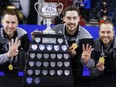 Team Wild Card One skip Brad Gushue, left, second Brett Gallant, centre, and lead Geoff Walker celebrate their victory over Team Alberta at the Tim Hortons Brier in Lethbridge, Alta., Sunday, March 13, 2022.