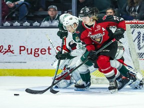 Vancouver Giants defenceman Connor Horning battles for position with Everett Silvertips forward Michal Gut in Everett's 5-2 win at home on Saturday.