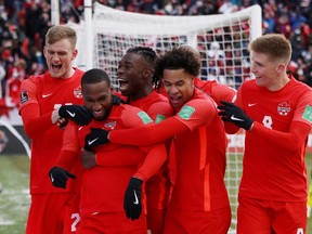 Canada's Junior Hoilett celebrates scoring their third goal over Jamaica with teammates at BMO field Toronto. Canada would go on to qualify for Qatar 2022 world cup. REUTERS/Carlos Osorio