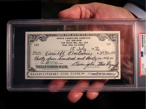 A 1976 Apple Computer check signed by founders Steve Jobs and Steve Wozniak is displayed during a preview of items offered in RR Auction's "The Steve Jobs Revolution" sale, in New York City, U.S. March 8, 2022.