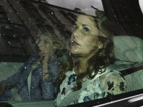 Princess Haya Bint al-Hussein, right, leaves The High Court for lunch in London, Wednesday, July 31, 2019.