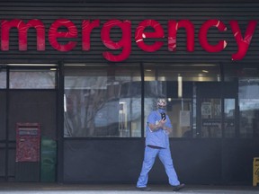 A health-care worker is seen outside the emergency department of the Vancouver General Hospital in Vancouver.