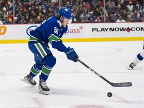 Vancouver Canucks forward Sheldon Rempal (56) handles the puck against the Tampa Bay Lightning in the second period at Rogers Arena.