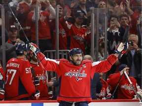 Washington Capitals left wing Alex Ovechkin (8) salutes the fans after scoring a goal against the New York Islanders in the third period at Capital One Arena. It was Ovechkin's 767th NHL goal, moving him into third place in all-time goals.