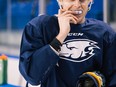 An unnamed UBC hockey player wearing a mouthguard with a computer chip in it to measure the impact of hits to the head. Photo: Kai Jacobson/UBC Faculty of Applied Science.