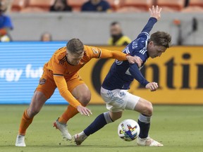 Dynamo 2, Whitecaps 1: Darwin Proves The Theory Of Natural Selection 2 Houston Dynamo Fc Defender Adam Lundkvist (3) Chases Vancouver Whitecaps Fc Midfielder Ryan Gauld (25) In The First Half At Pnc Stadium. Photo: Thomas Shea-Usa Today Sports