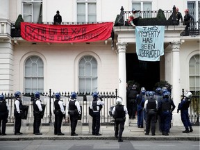 Police officers prepare to enter a mansion reportedly belonging to Russian billionaire Oleg Deripaska, who was placed on Britain's sanctions list last week, as squatters occupy it, in Belgravia, London, Britain, March 14, 2022.