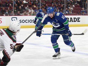 Canucks captain Bo Horvat winces after being hit by a teammate’s shot and skates to the team bench during their April 14 NHL game against the visiting Arizona Coyotes. Horvat, whose leg was fractured, missed the rest of the season.