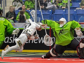 Saskatoon Rush goalie Eric Penney tries to block a shot by Kyle Killen during action against the Vancouver Warriors at SaskTel Centre on April 9.