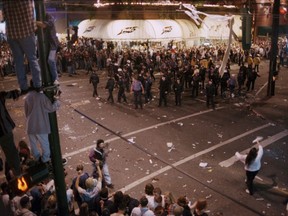 Police at the intersection of Robson and Burrard streets on the night of June 14, 1994, in the aftermath of the Vancouver Canucks losing Game 7 of the Stanley Cup Final series in New York to the Rangers.