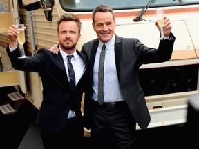 Actors Aaron Paul and Bryan Cranston arrive as AMC Celebrates the final episodes of "Breaking Bad" at Sony Pictures Studios on July 24, 2013 in Culver City, Calif.