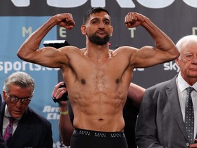 Amir Khan stands on the scales during the official weigh-in at Manchester Central Convention Complex ahead of his fight against Kell Brook on Feb. 18, 2022 in Manchester, England.