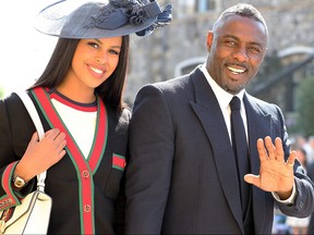 Idris Elba and Sabrina Dhowre arrive at St. George's Chapel at Windsor Castle before the wedding of Prince Harry to Meghan Markle on May 19, 2018 in Windsor, England.