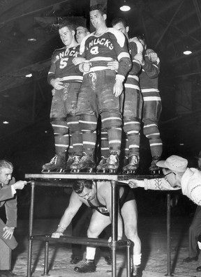 In this Dec. 30, 1958 Vancouver Sun file photo, world champion weightlifter Doug Hepburn lifts six Vancouver Canucks hockey players, a total of 1,500 pounds. Photo: Roy LeBlanc