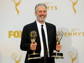 Jon Stewart holds his awards for Outstanding Writing For A Variety Series and Outstanding Variety Talk Series for Comedy Central's "The Daily Show With Jon Stewart" during the 67th Primetime Emmy Awards in Los Angeles on Sept. 20, 2015.