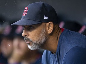 Apr 13, 2022; Detroit, Michigan, USA; Boston Red Sox manager Alex Cora looks on from the dugout during the third inning against the Detroit Tigers at Comerica Park.