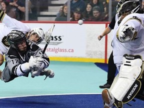 The Calgary Roughnecks' Curtis Dickson (17) shoots against Vancouver Warriors goaltender Alex Buque on Westjet Field at Scotiabank Saddledome in Calgary on Friday, April 1, 2022.