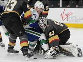 Vancouver Canucks left wing Tanner Pearson (70) attempts a shot on Vegas Golden Knights goaltender Robin Lehner (90) during the first period of an NHL hockey game Wednesday, April 6, 2022, in Las Vegas.