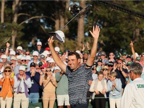 Scottie Scheffler of the U.S. celebrates on the 18th green after winning The Masters.