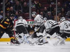 Vancouver Canucks goaltender Spencer Martin (30) stops Los Angeles Kings defenceman Mikey Anderson (44) during second period NHL action in Vancouver on Thursday, April 28, 2022.