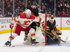 Flames winger Matthew Tkachuk is always a handful around the net for goalie Thatcher Demko and the Vancouver Canucks. Tkachuk hopes to add to his 40 goals and 100 points on Saturday in Calgary.