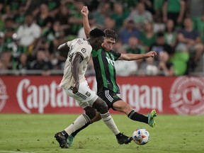 Los Angeles FC defender Jesus Murillo, left, and Austin FC midfielder Sebastian Berhalter, right, battle during a 2021 game in Austin, Texas. Berhalter was an off-season acquisition by the Vancouver Whitecaps, and returns to Texas to play his old team this weekend.