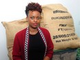 Nadine Umutoni, a genocide survivor from Rwanda, with her locally roasted coffee beans, in Vancouver on April 5.