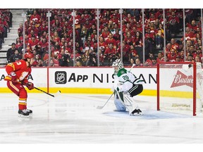 CALGARY, AB - MAY 5: Johnny Gaudreau #13 of the Calgary Flames scores on Jake Oettinger #29 of the Dallas Stars during the first period of Game Two of the First Round of the 2022 Stanley Cup Playoffs at Scotiabank Saddledome on May 5, 2022 in Calgary, Alberta, Canada. Gaudreau's score was shot from offside and officially called off.