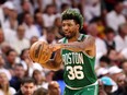 Marcus Smart of the Boston Celtics brings the ball up court against the Miami Heat in Game 2 of the NBA Eastern Conference Finals in Miami on May 19, 2022.
