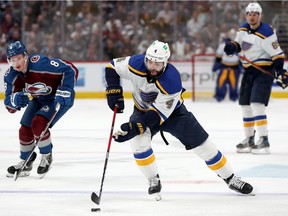 Nick Leddy #4 of the St Louis Blues advances the puck against Cale Makar #8 of the Colorado Avalanche in the third period during Game Two of the Second Round of the 2022 Stanley Cup Playoffs at Ball Arena on May 19, 2022 in Denver, Colorado.