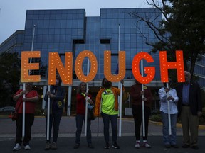 Gun-control advocates hold a vigil outside of the National Rifle Association (NRA) headquarters following the recent mass shooting at Robb Elementary School on May 25, 2022 in Fairfax, Virginia. The group is calling for gun law reforms after an 18-year-old gunman killed 19 children and two teachers in Uvalde, Texas.