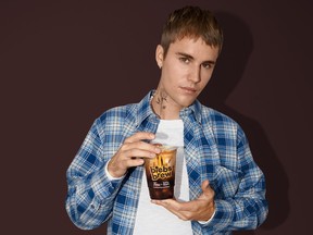 Justin Bieber and Tim Hortons are collaborating on a new line of drinks for the summer