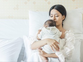 A mother and a newborn baby are pictured in a file photo