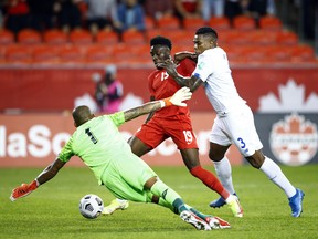 Canadian star Alphonso Davies (centre) works some of his magic, and is the centre of attention, against Panama in World Cup qualifying at Toronto’s BMO Field last October.