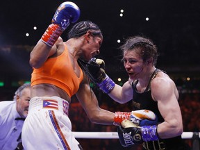 Katie Taylor of Ireland (right) trades punches with Amanda Serrano of Puerto Rico for the World Lightweight Title at Madison Square Garden on April 30, 2022 in New York.