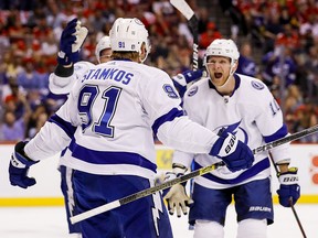 Tampa Bay Lightning right wing Corey Perry (10) celebrates with Steven Stamkos (91) after scoring against the Florida Panthers during Game 2 of the second round of the Stanley Cup Playoffs at FLA Live Arena.